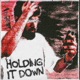 HOLDING IT DOWN Single